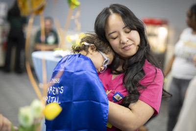 NICU nurse posing with a child