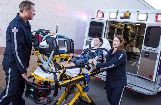 Child being loaded into ambulance